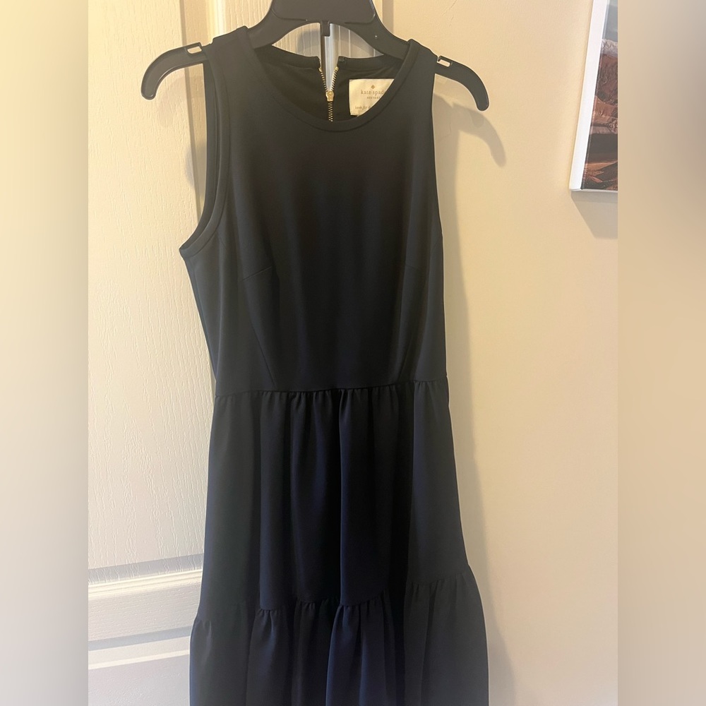 Beautiful simple black dress with pockets.